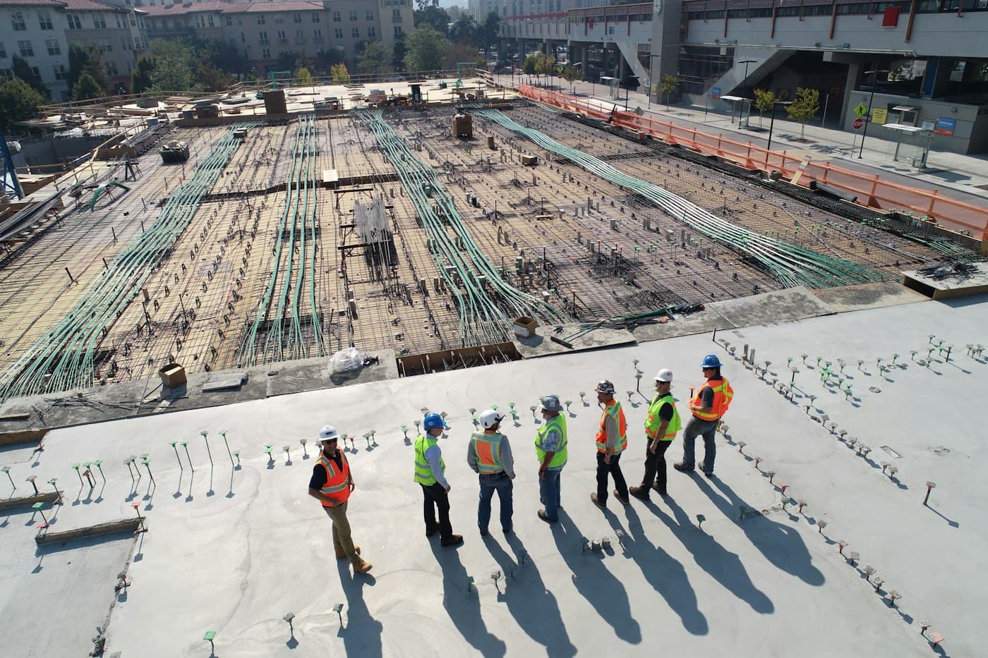 Site team in hard hats on a large construction project